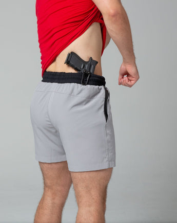 Holster close up on grey training shorts right side