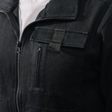 Close-up of a black jacket with zippers and pockets