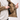 Utility Bomber Jacket - Field Tan - interior view, pulling a magazine from the inside magazine pocket beside the pass-through zipper