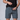 A model wearing dark grey training shorts revealing a front zipper