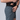 A model wearing dark grey training shorts revealing a zippered hand pocket