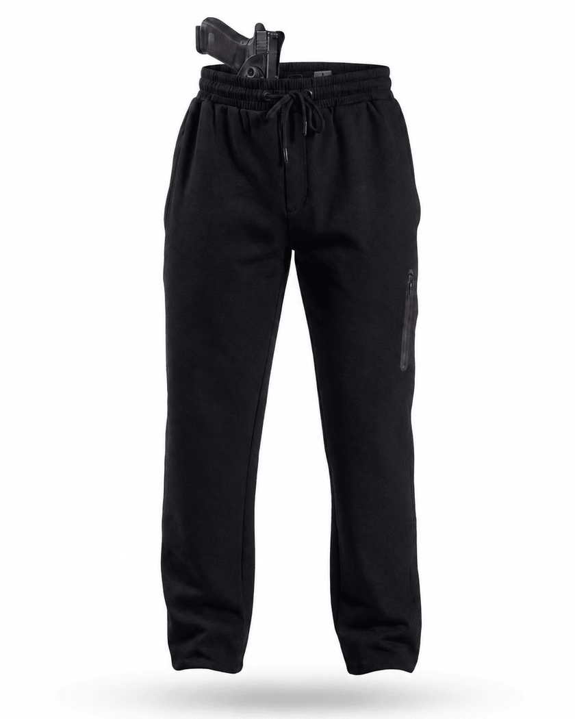 Black sweatpants with a drawstring waist, a vertical zippered pocket on the left thigh, and a black handgun holstered in the waistband, shown against a plain white background.