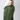 A side view of a person wearing green concealed carry joggers showing a knife pocket.
