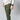 A front view of a person wearing green concealed carry joggers showing a small, color-matched logo on the leg.