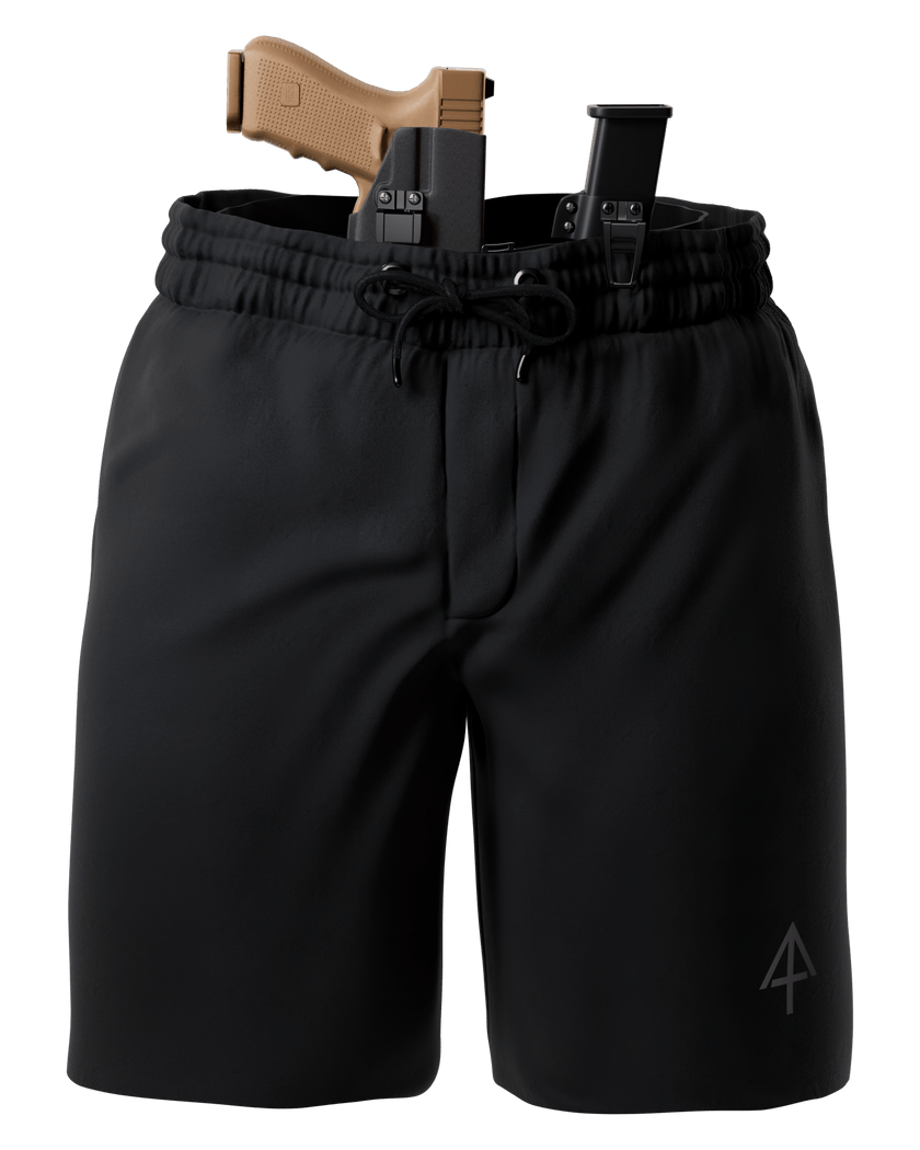 Black drawstring shorts with a tactical holster and handgun inserted at the waist, shown on a plain white background.