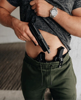 Black mag carrier with green joggers front 