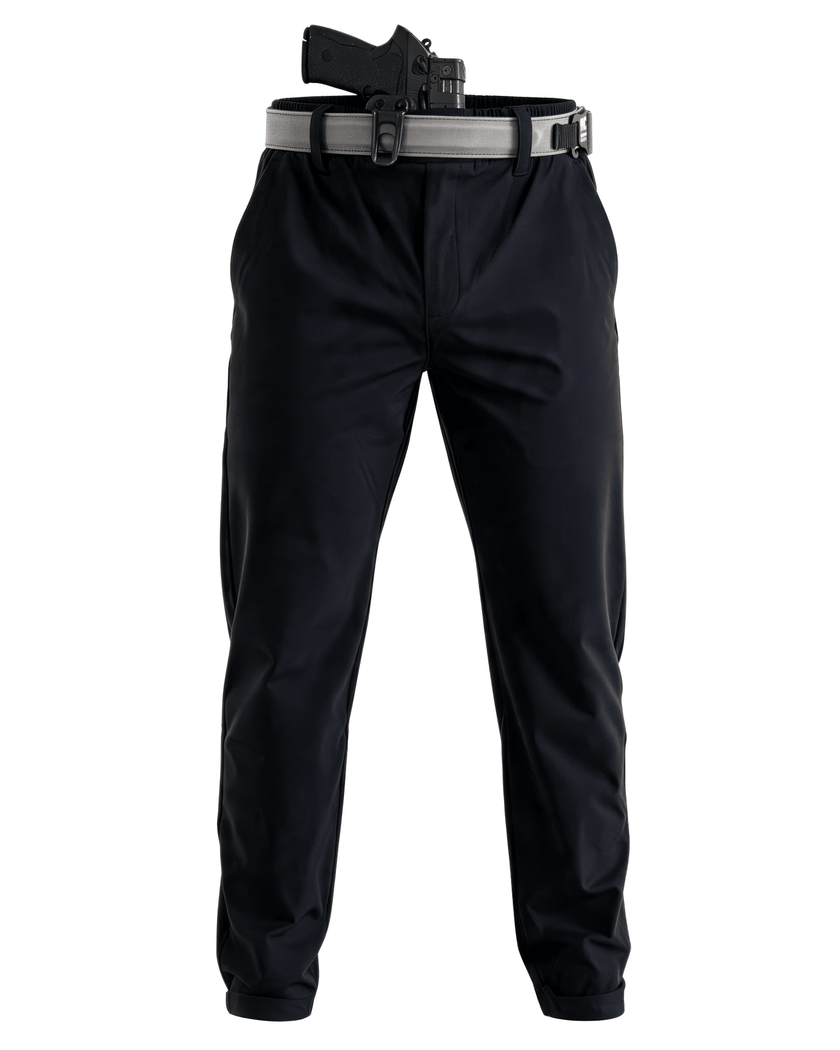 Black Constantine Carry Pants shown on a white background, styled with a grey belt and a black holster containing a handgun at the waist.