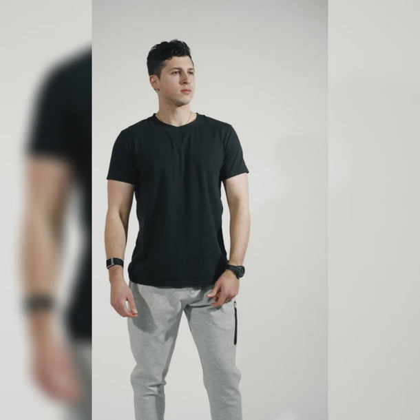 Studio video showing grey and black joggers designed for concealed carry, demonstrating features. #color_black