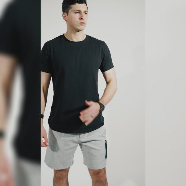 Studio video demonstrating the features of Everyday Carrier Shorts #color_heather-grey