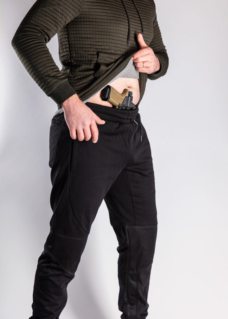 Black joggers front with gun
