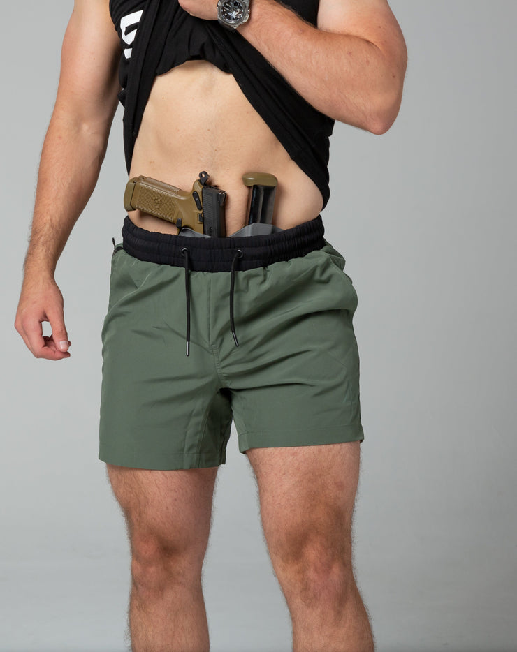 Green training shorts front concealed carry