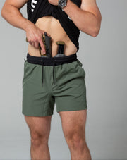 Green training shorts front concealed carry